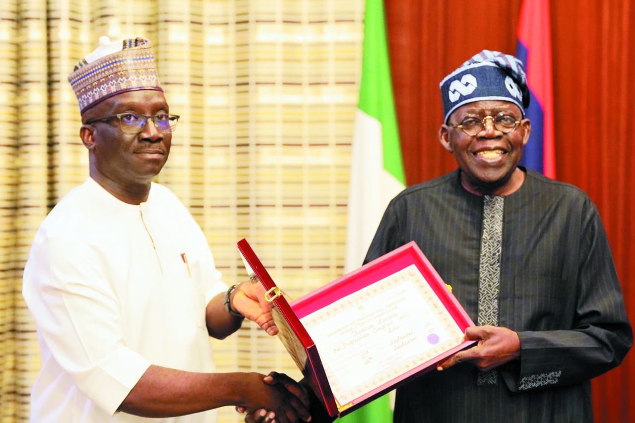 Edo Governor-elect, Mr Monday Okpebholo presenting his certificate of return to President Bola Tinubu at the Presidential Villa on Thursday [Presidency]